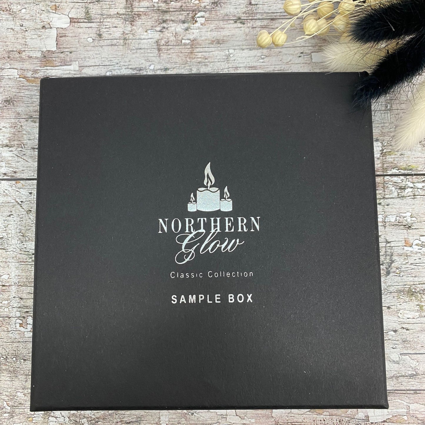 Classic Collection Wax Melt sample box is black with the logo in the centre and silver writing with the words 'Classic Collection' 'Sample Box' in the centre.