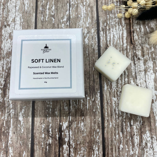 White square wax melts next to a small white box