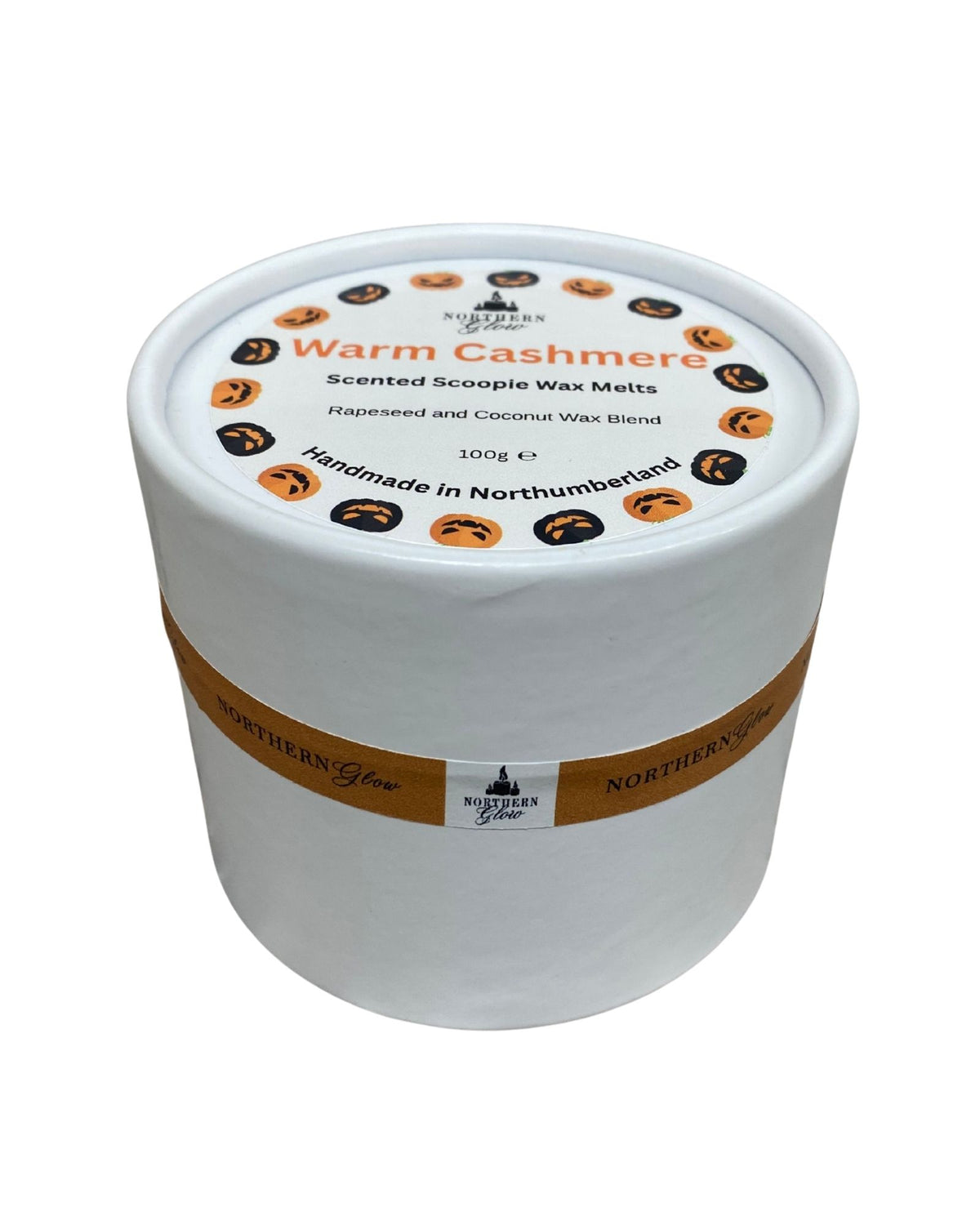 Northern Glow Warm Cashmere scented scoopie wax melts in a white round tub with Halloween-themed lid and orange branded ribbon, on a white background.